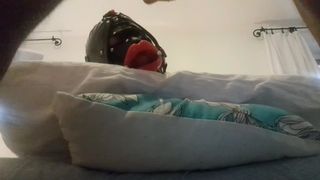My wifey is hogtied on the bed with an open gag on her mouth. I sexed her throat and spunked on her