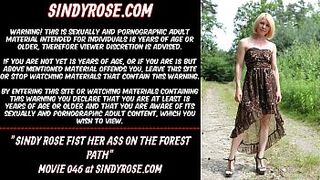 Sindy Rose fist her ass on the forest path